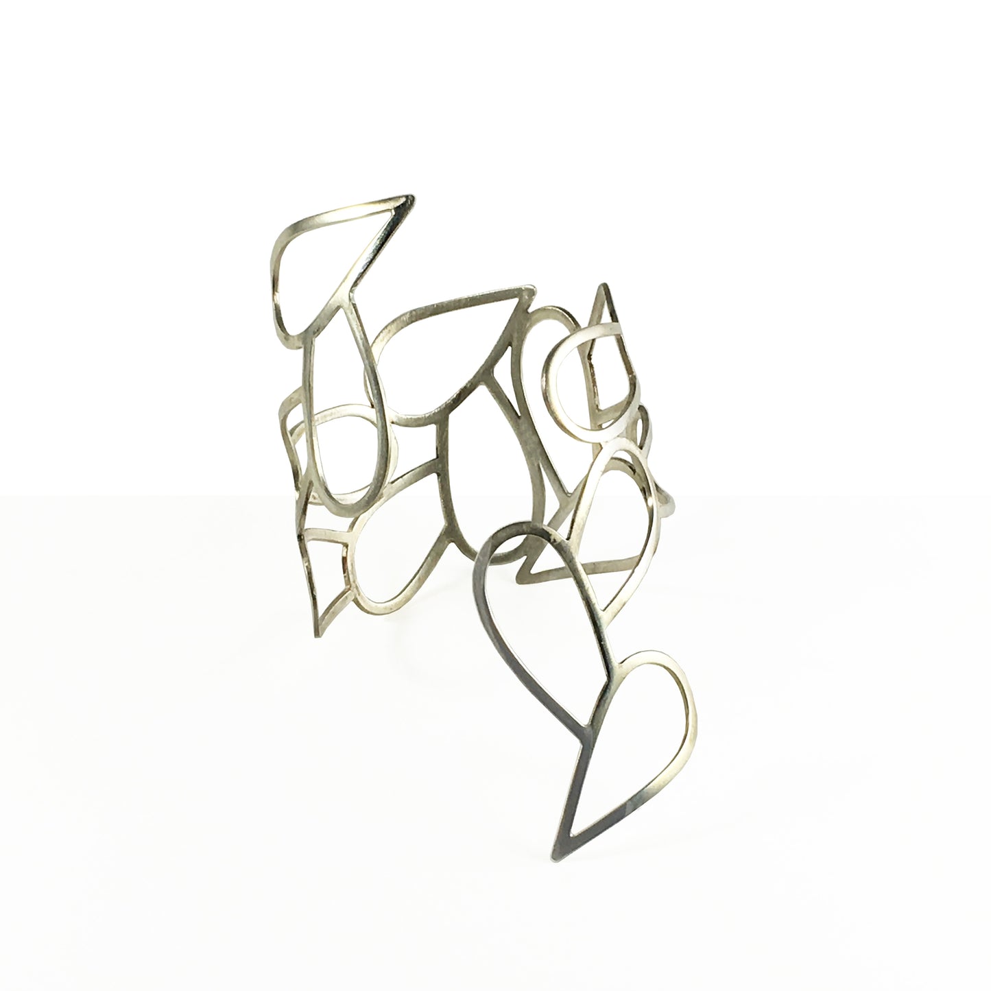 Helena Collection bring the beauty of the ancient Greek world to the contemporary woman. All pieces are cut bent polished and personally handcrafted by Laura. Laura’s collections reflect her love of architecture organic and natural shapes simplicity subtlety sensuality exclusive designs synthesized in every piece.